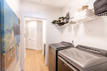 A laundry room with a washer and dryer.